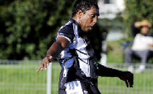 JAMES KING clears the ball for Lower Clarence against Northern United. JAMES KING clears the ball for Lower Clarence against Northern United.